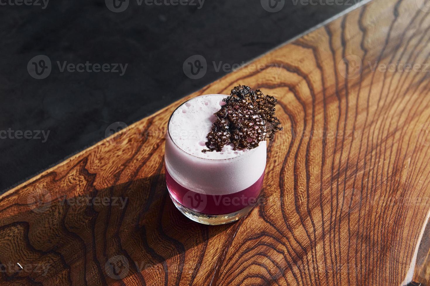 Delicious drink. Close up view of fresh summer cocktail on the wooden table photo
