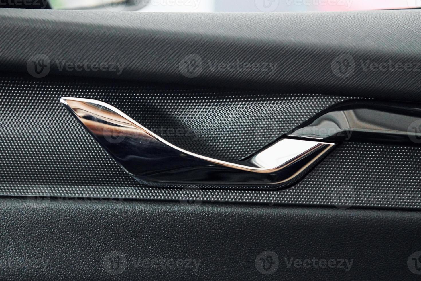 Car's window. Close up focused view of brand new modern black automobile photo