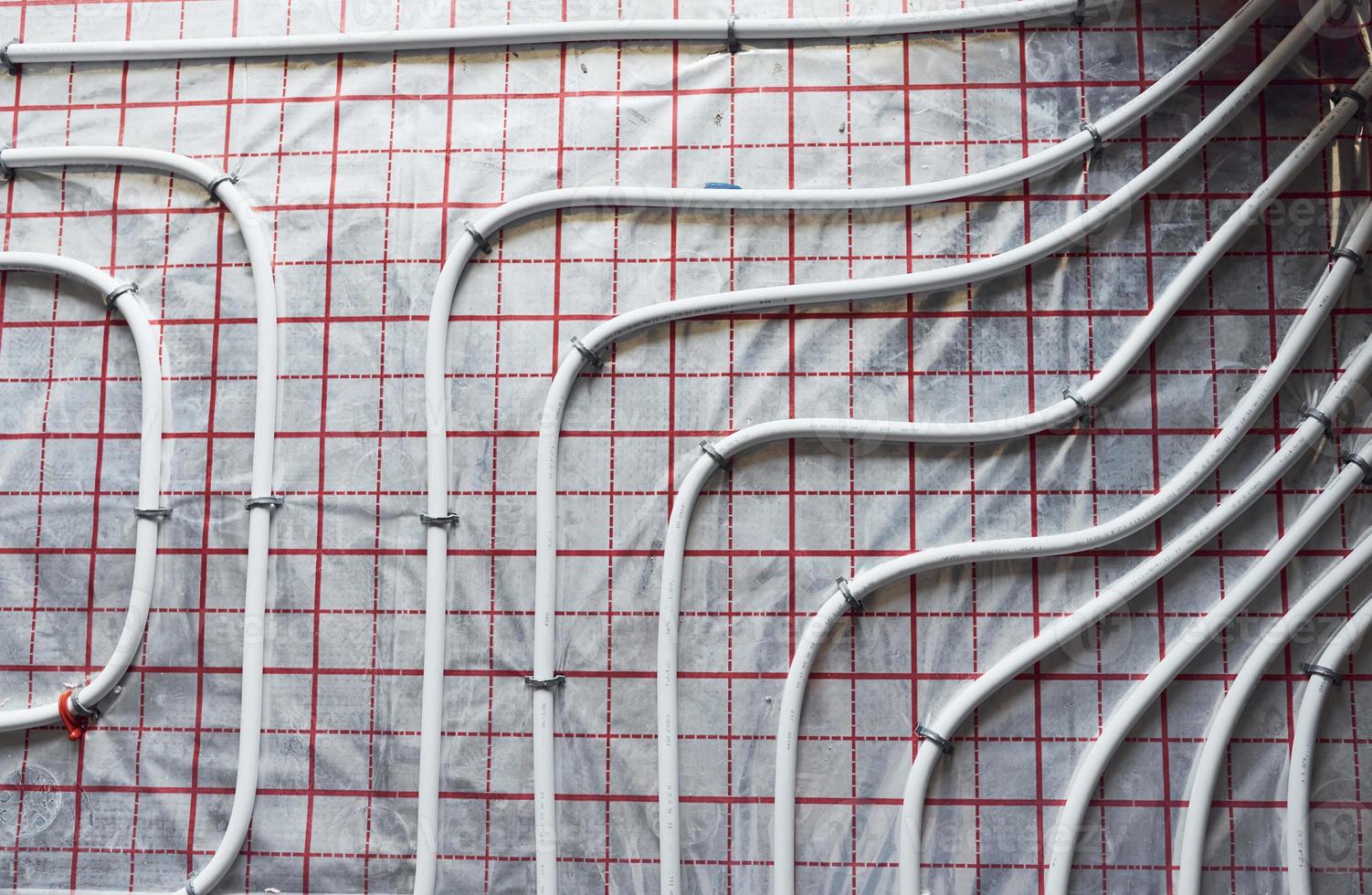 Pipes of underfloor heating system. Close up view. No people photo