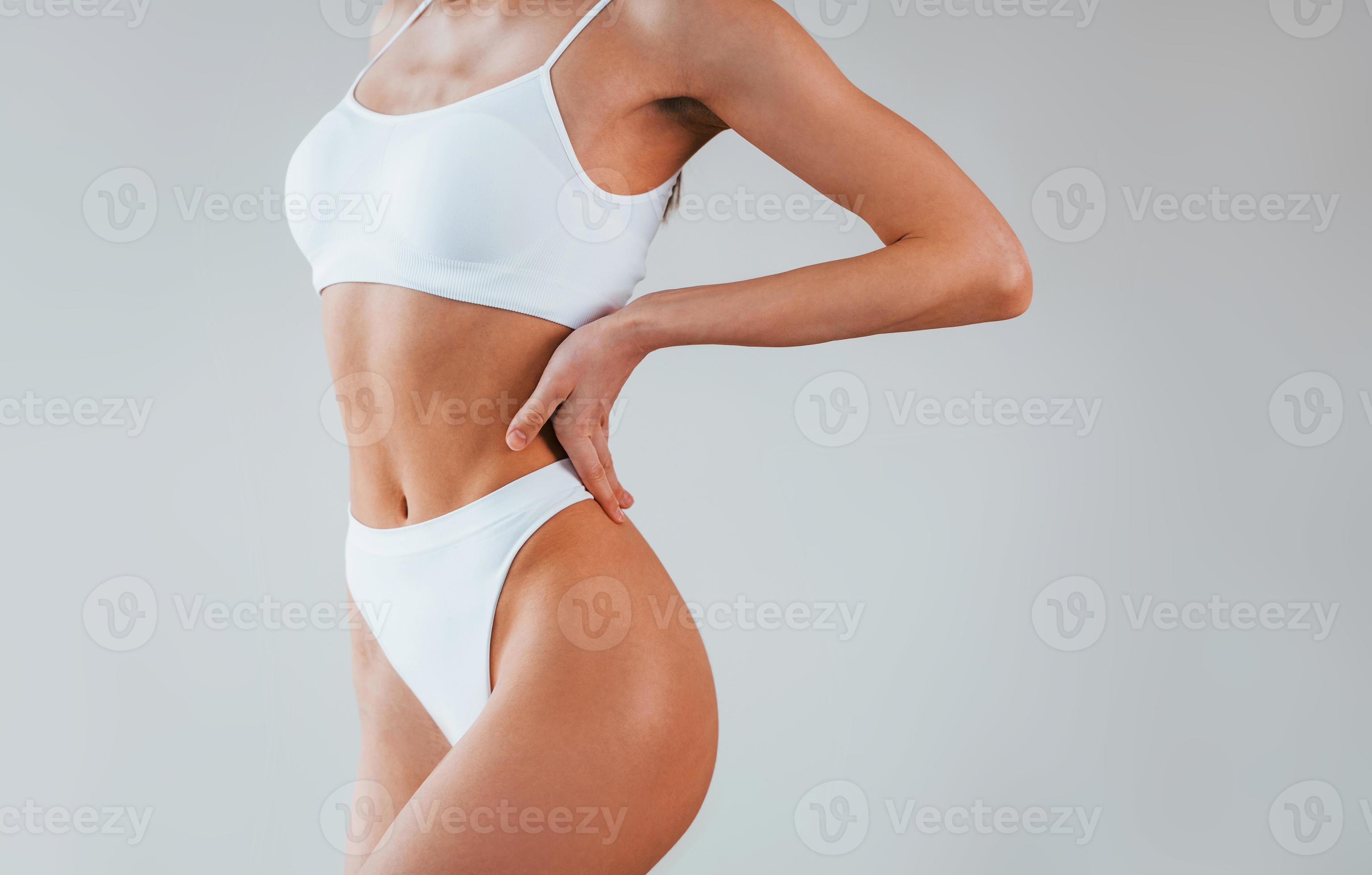 Particle view. Woman with sportive slim body type in underwear that is in  the studio 15303491 Stock Photo at Vecteezy