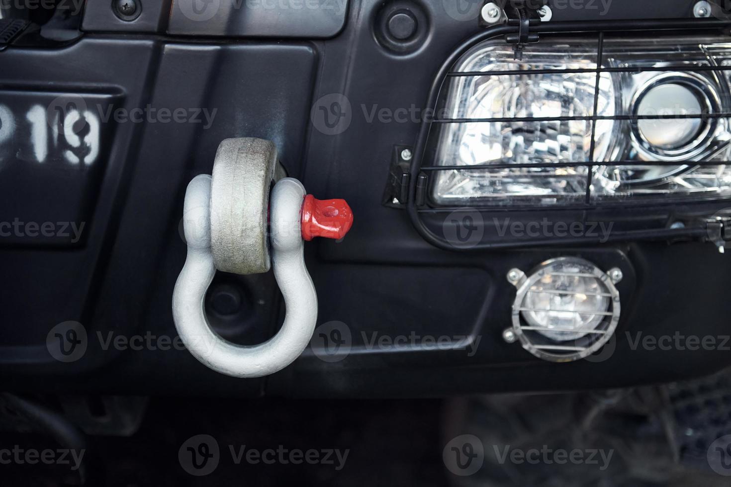 Close up view of fire truck. Particle view of front part. Headlights is off photo