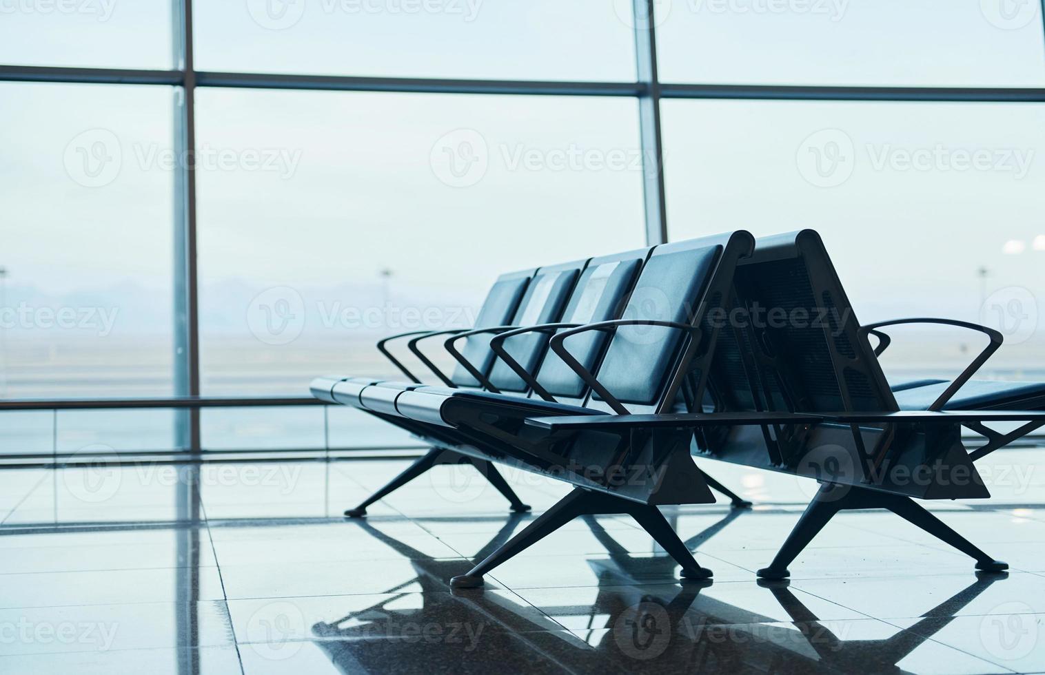 Interior of modern airport at daytime with no people inside it photo