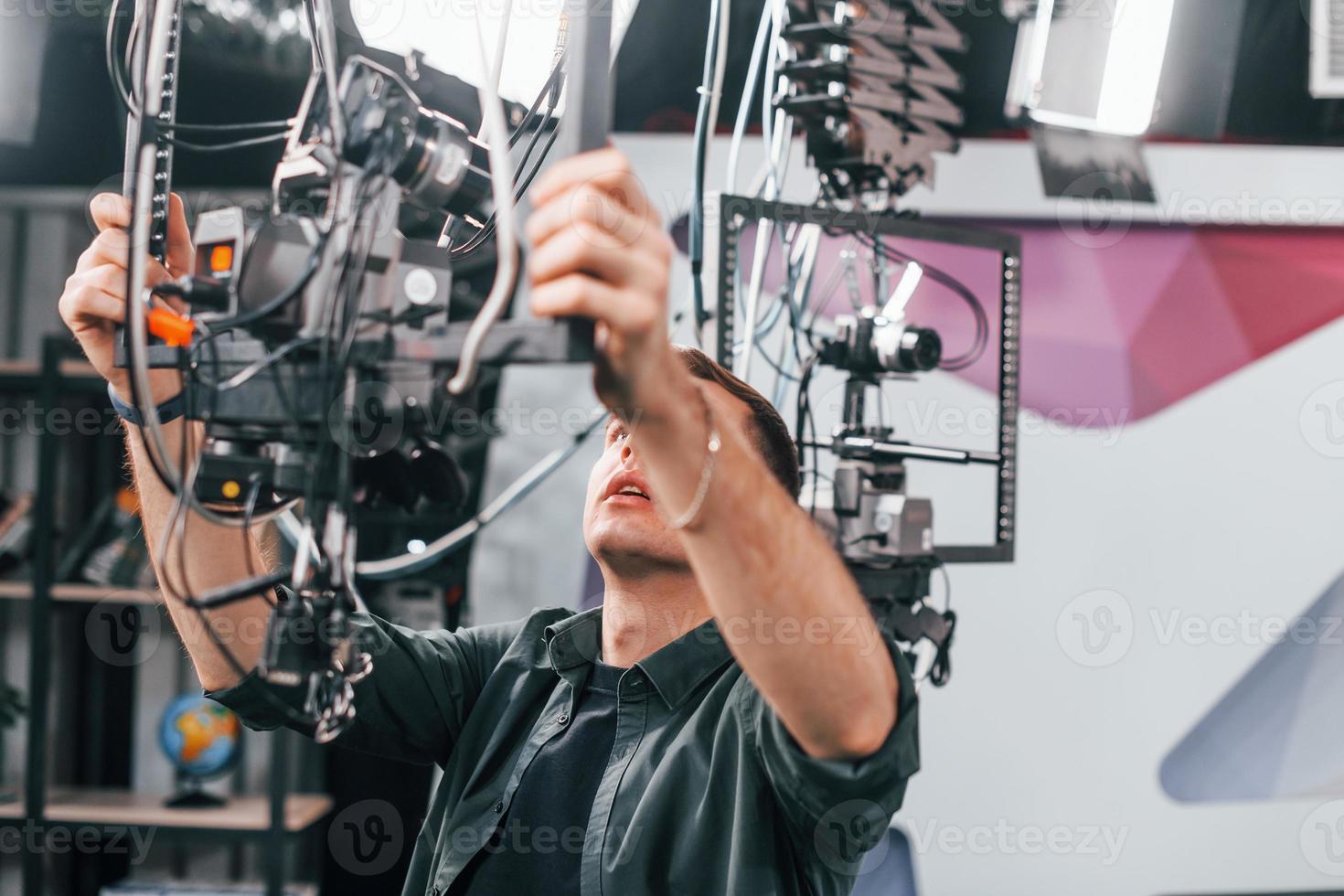 Testing the camera. Young man is preparing for TV online broadcast photo