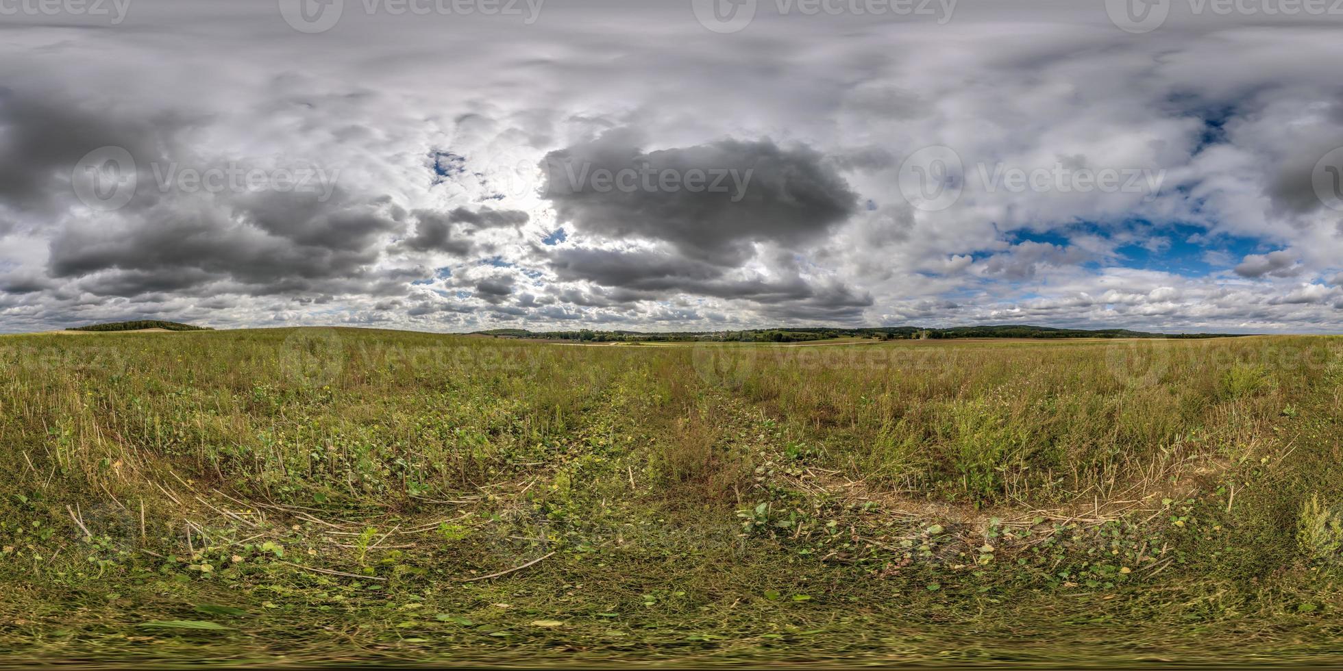 full seamless 360 hdri panorama view among farming fields with clouds in overcast sky in equirectangular spherical projection, ready for VR AR virtual reality content photo