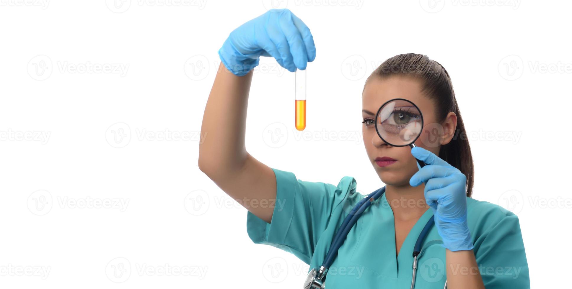 Portrait of serious doctor woman holding syringe with covid19 vaccine. photo