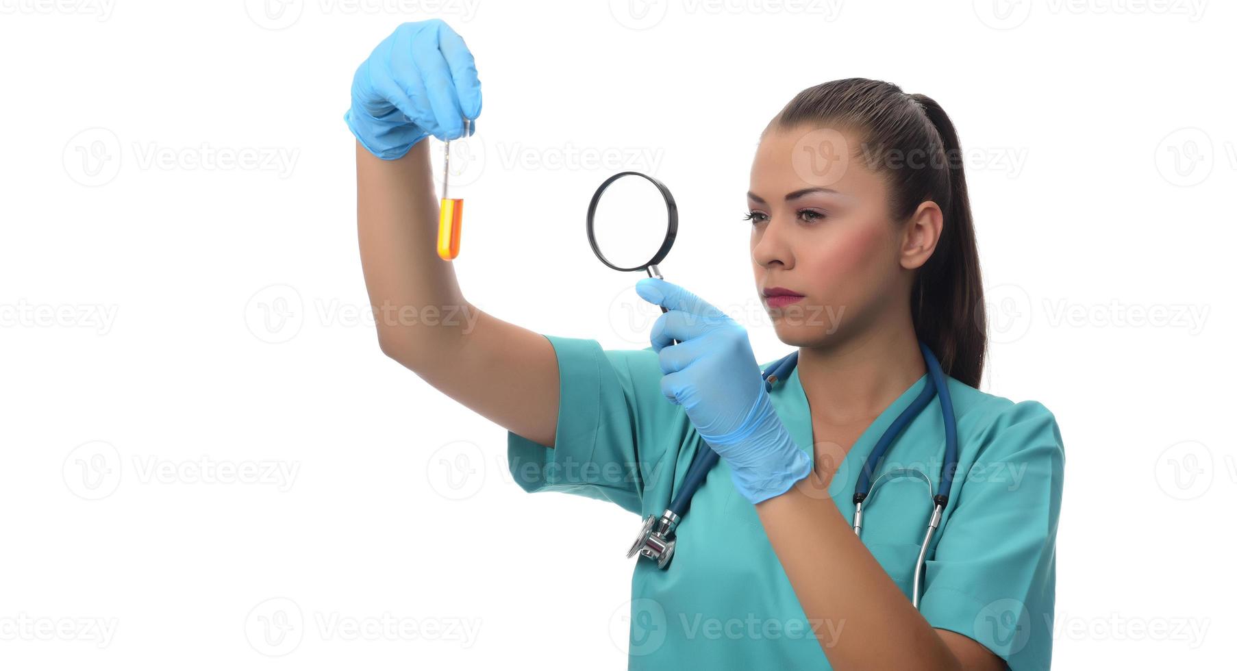 Portrait of serious doctor woman holding syringe with covid19 vaccine. photo