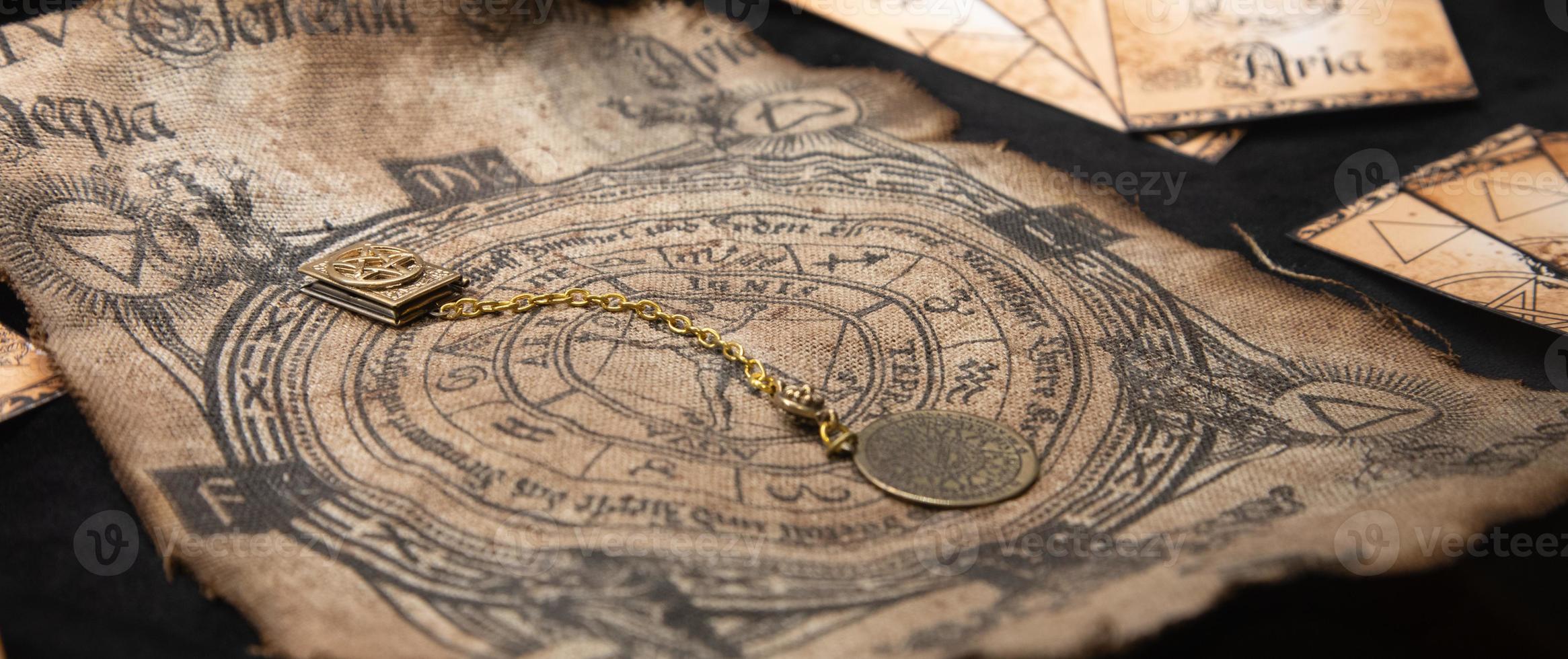 Ancient esoteric witchcraft background. Occultims and paganism old symbol, with mysterious runes alphabet photo