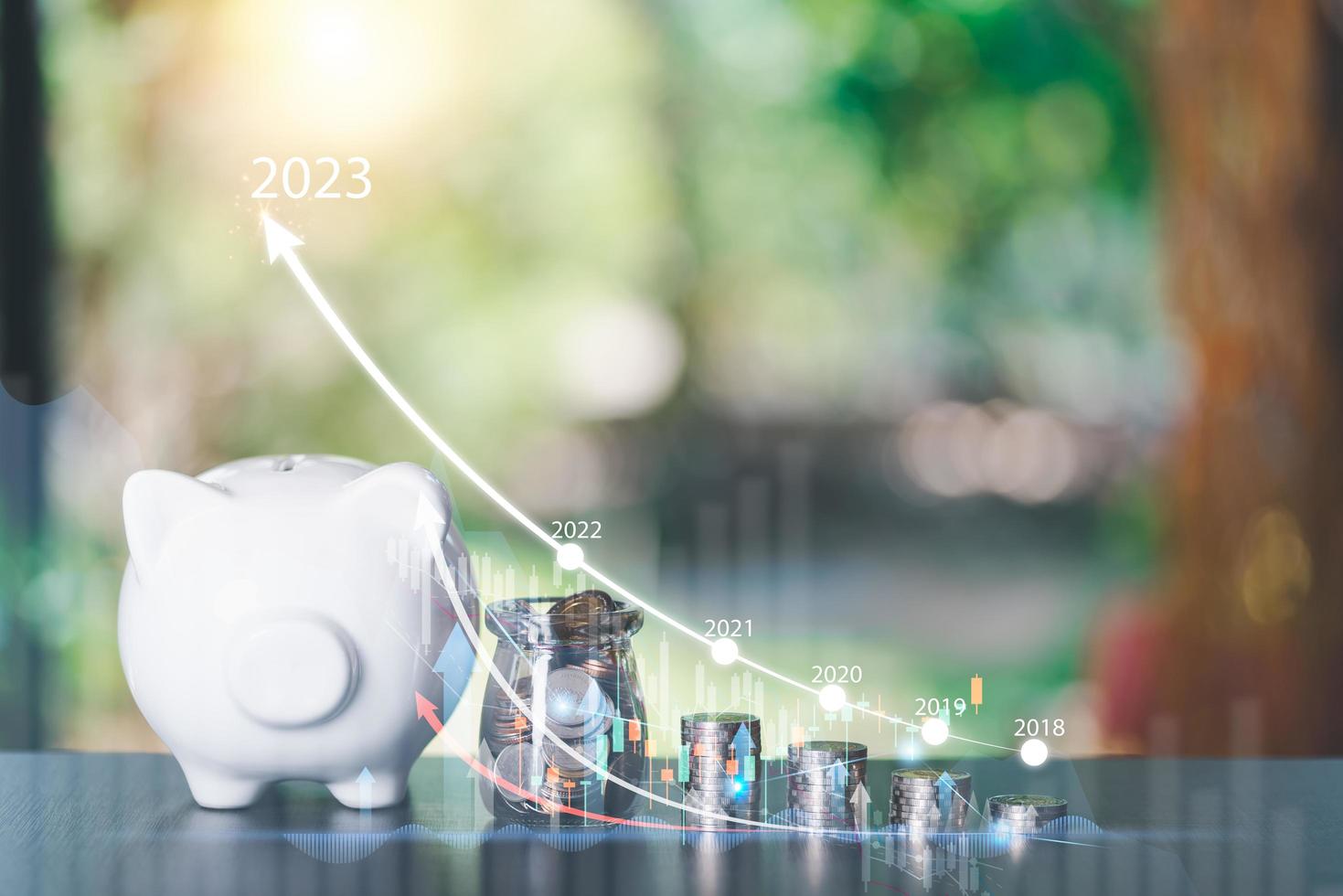 New Year start concepts,Piggy bank, stack of coins, and growth chart,saving money for future goals,Business targeting and focus concept,the growth and purpose of the organization, photo