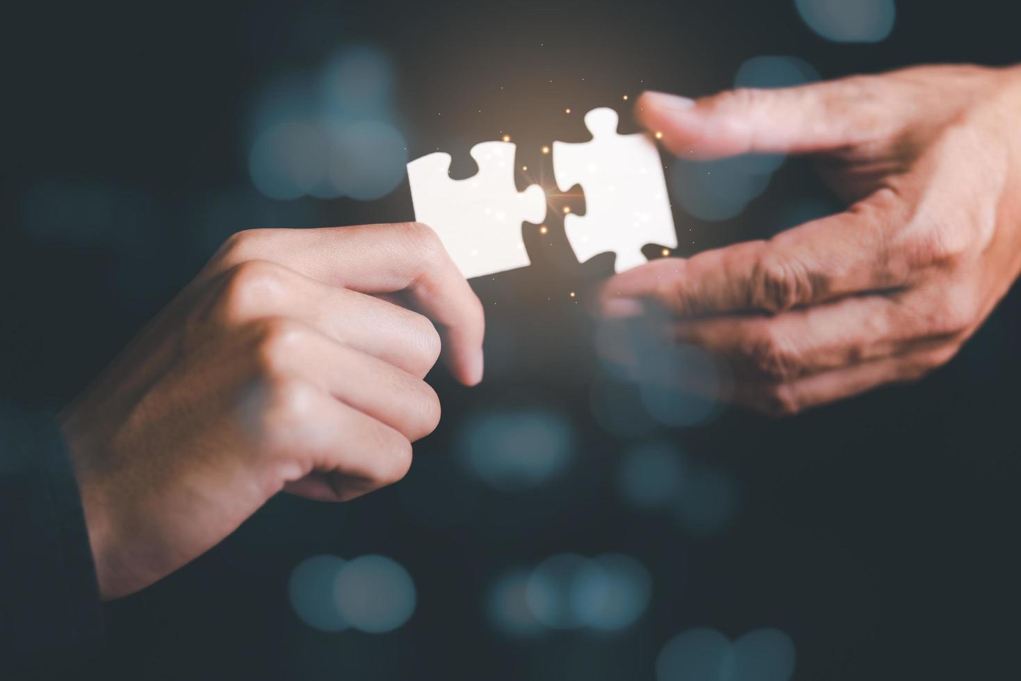 Businessman holding a puzzle piece to find a business solution,Connecting success and problem solution, from creativity,and strategic planning to develop the organization into the future photo