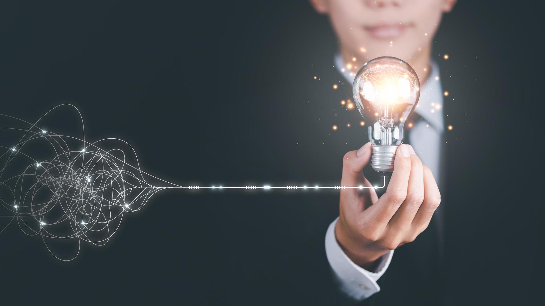 solution concept and demonstrating leadership strategies,Creativity that will lead the business in right direction,with innovation and brain power from brainstorming,businessman holding light bulb photo