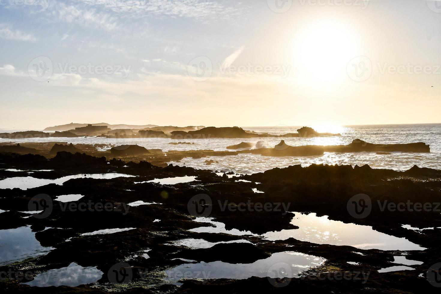 Sunset over the ocean photo