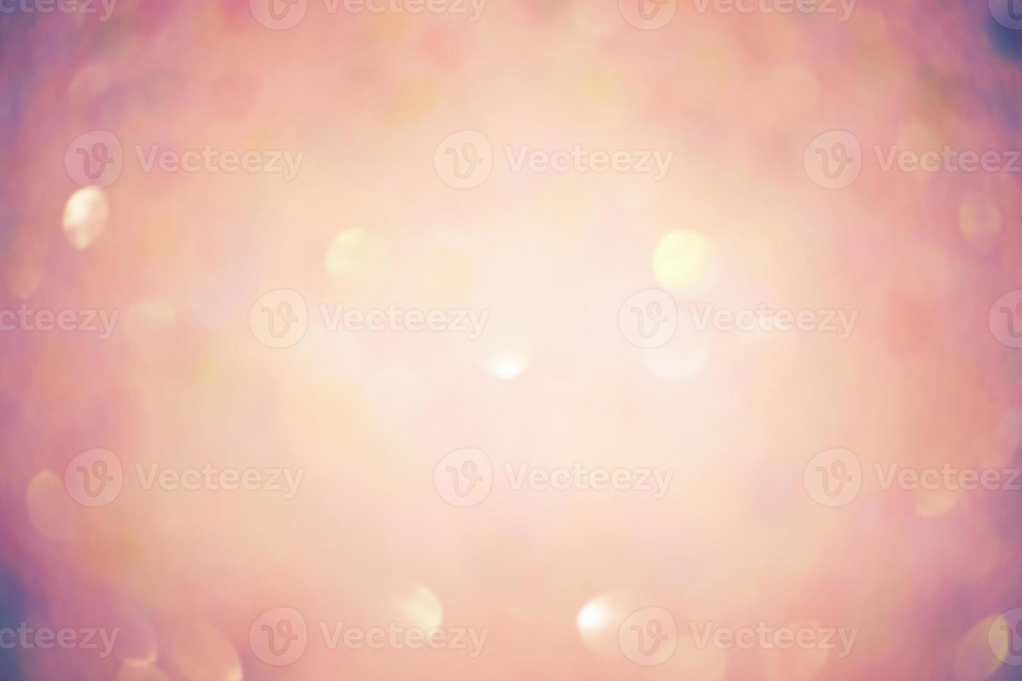 Peach yellow glitter blurred defocus background. Defocus lights with vignette edge. photo