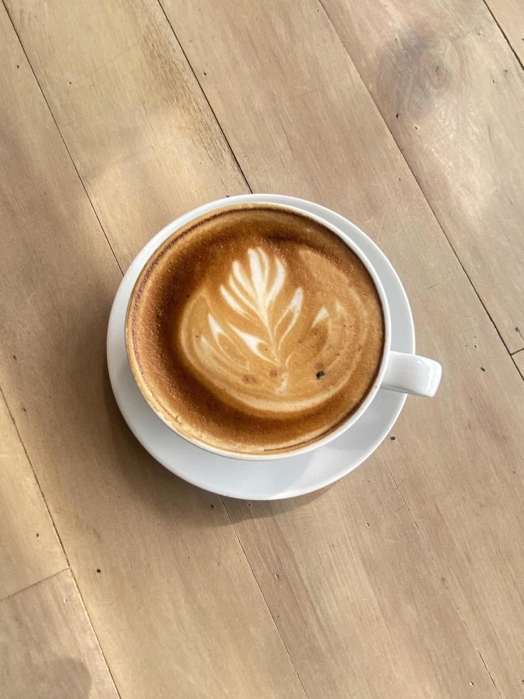 Hot coffee cup on table photo