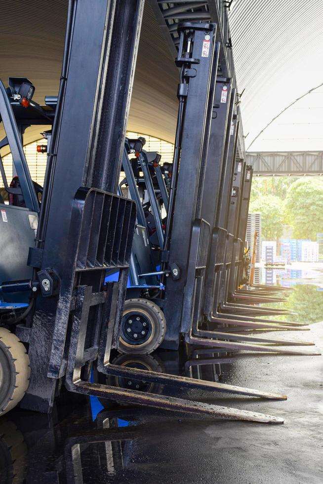 Forklift trucks parked in a warehouse. photo