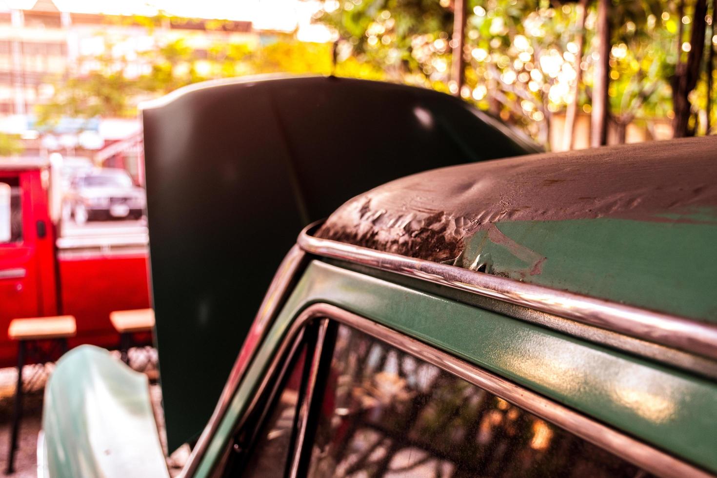 Rusty retro car open hood photo