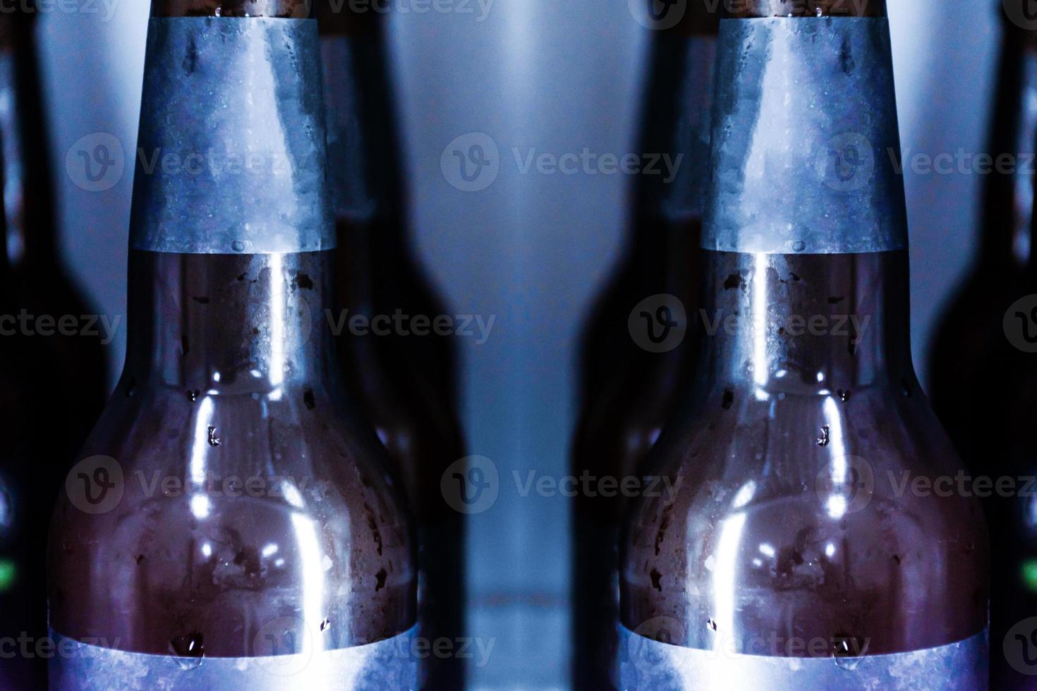 Close up Beer bottle without logo in refrigerator photo