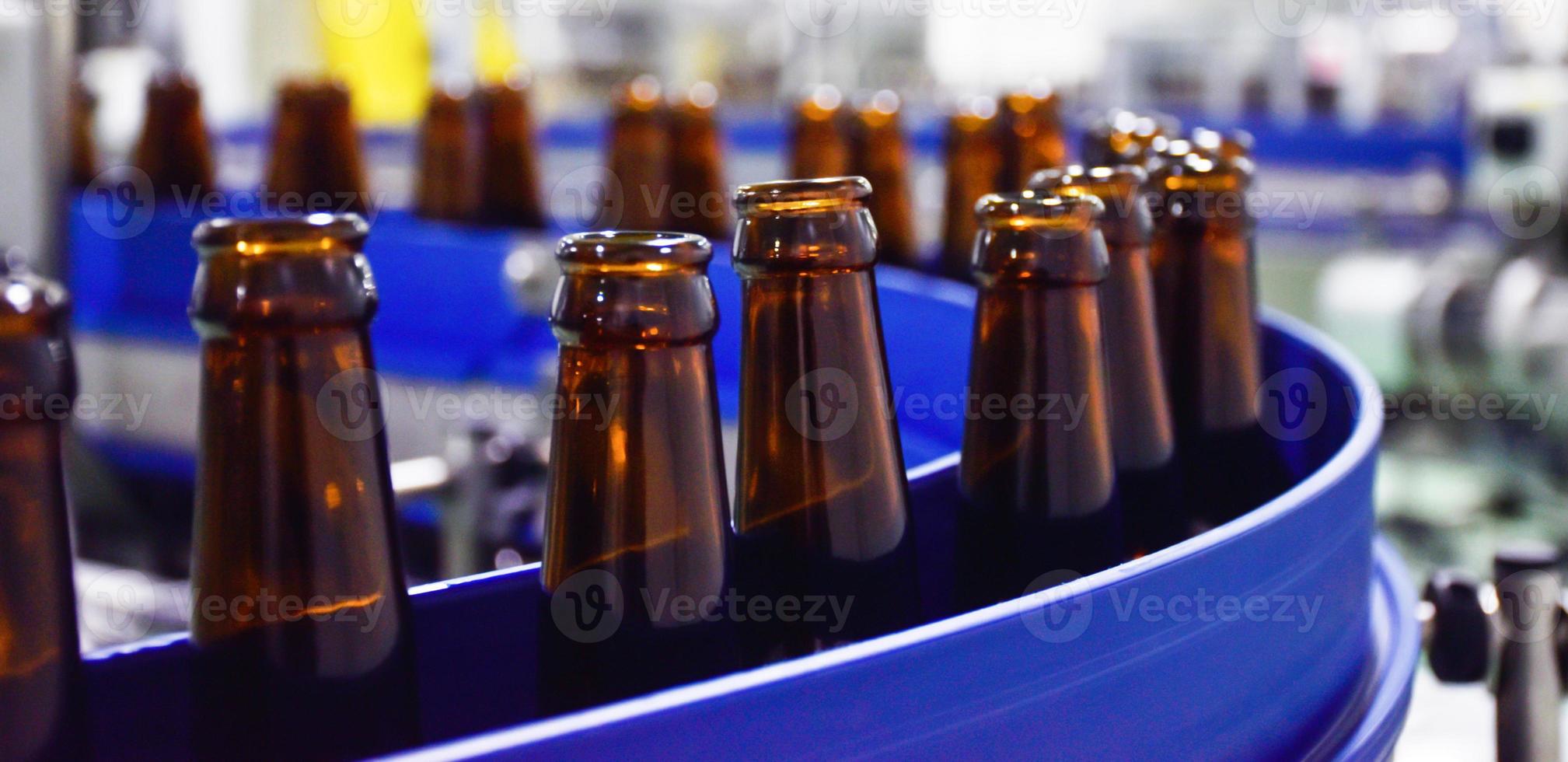 Beer bottle in conveyor belt photo