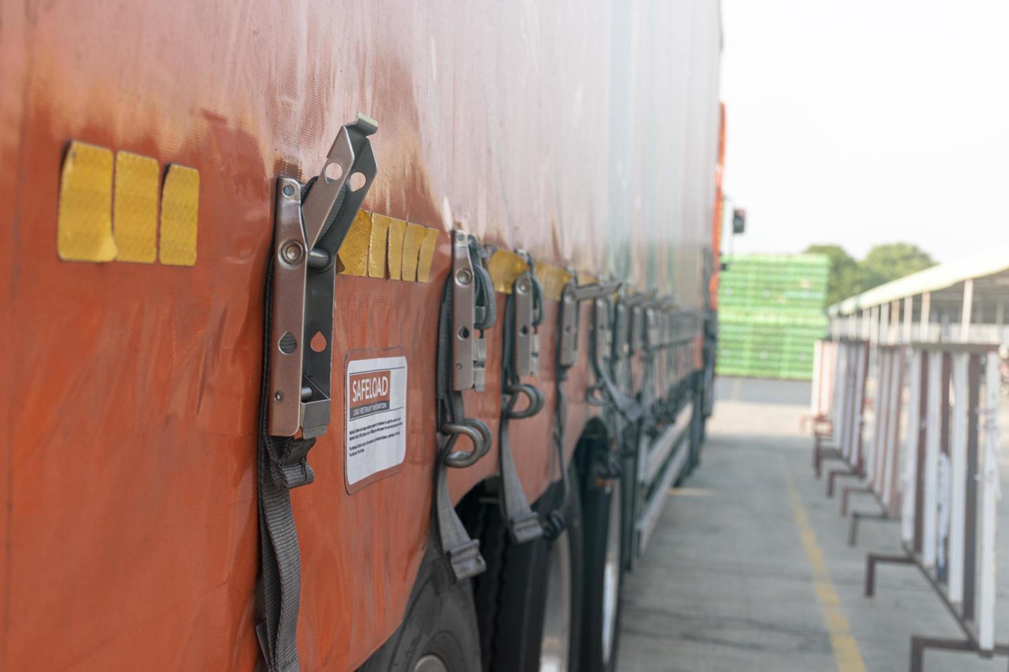 Close up orange trailer container is belt is not locked. Unsafe concept photo