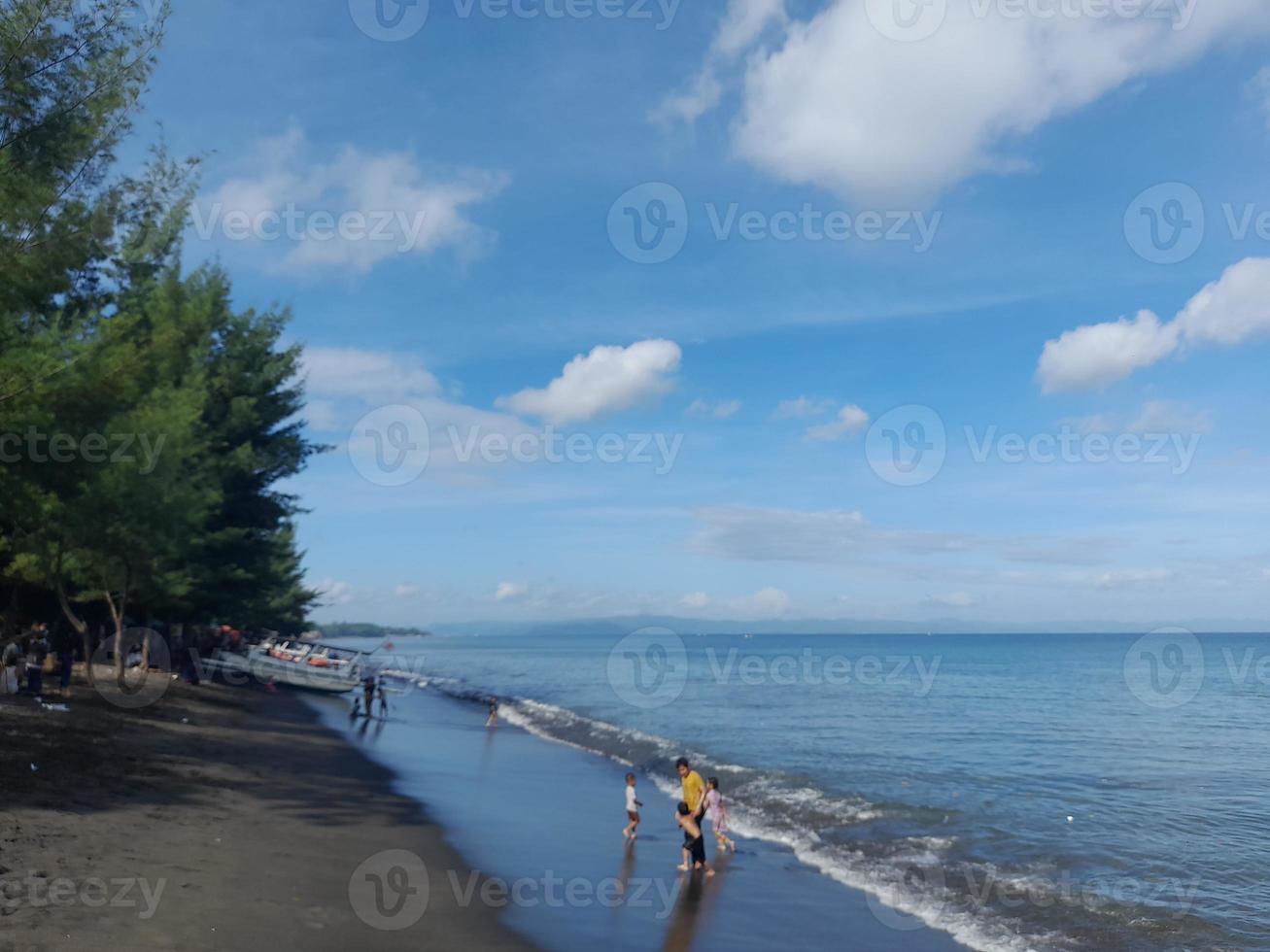 Beachside atmosphere with clear blue sky and weather on Lombok Island, Indonesia photo