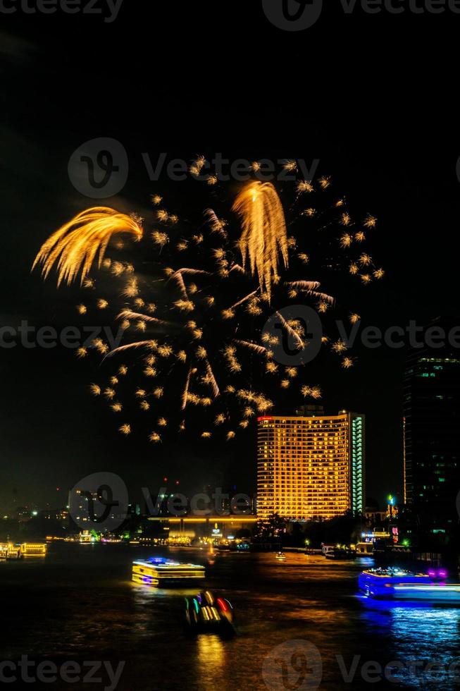 fireworks on the river in the dark sky photo