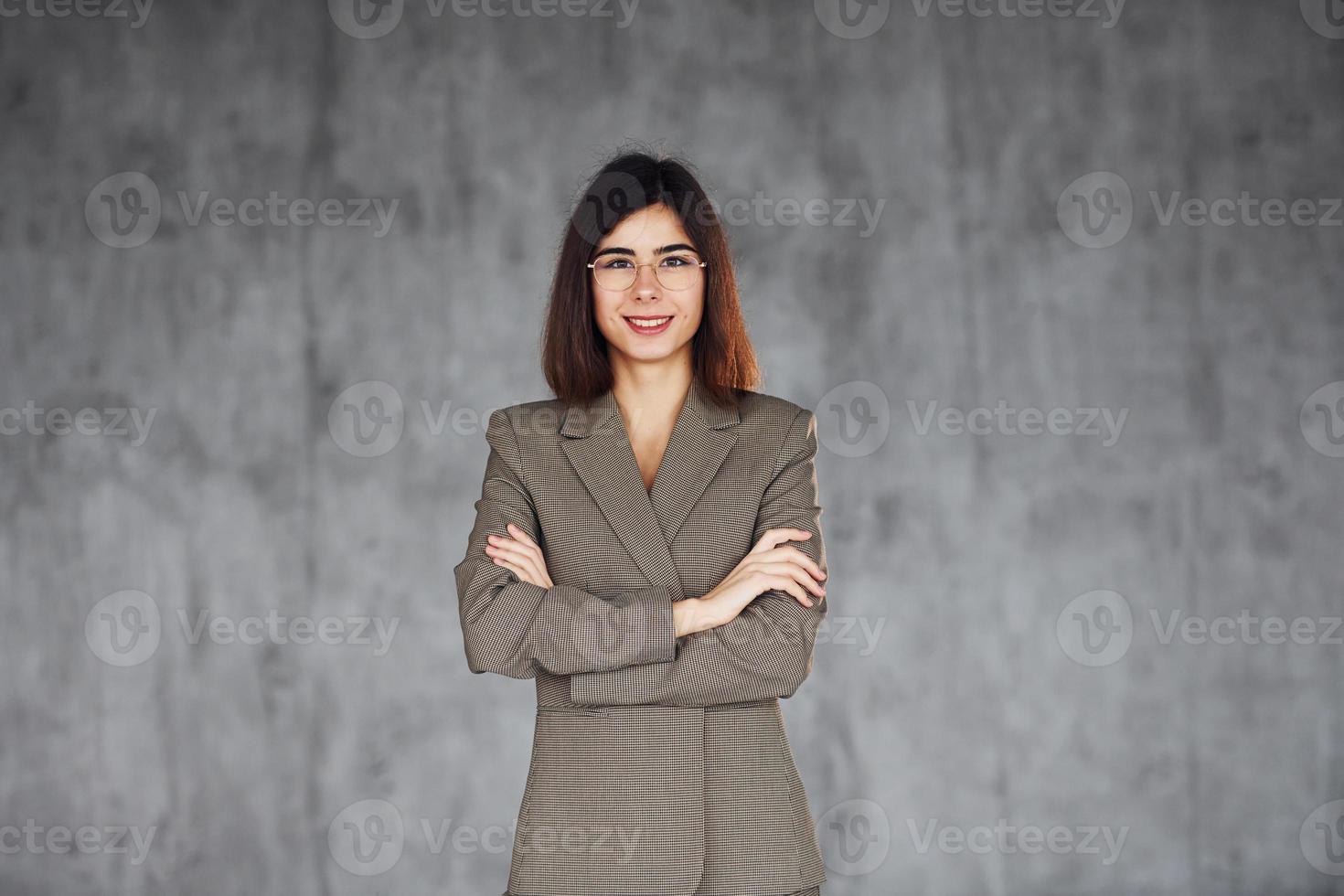 Young woman in formal clothes is indoors. Conception of style photo