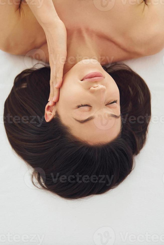 Close up view of woman that lying down on the couch photo