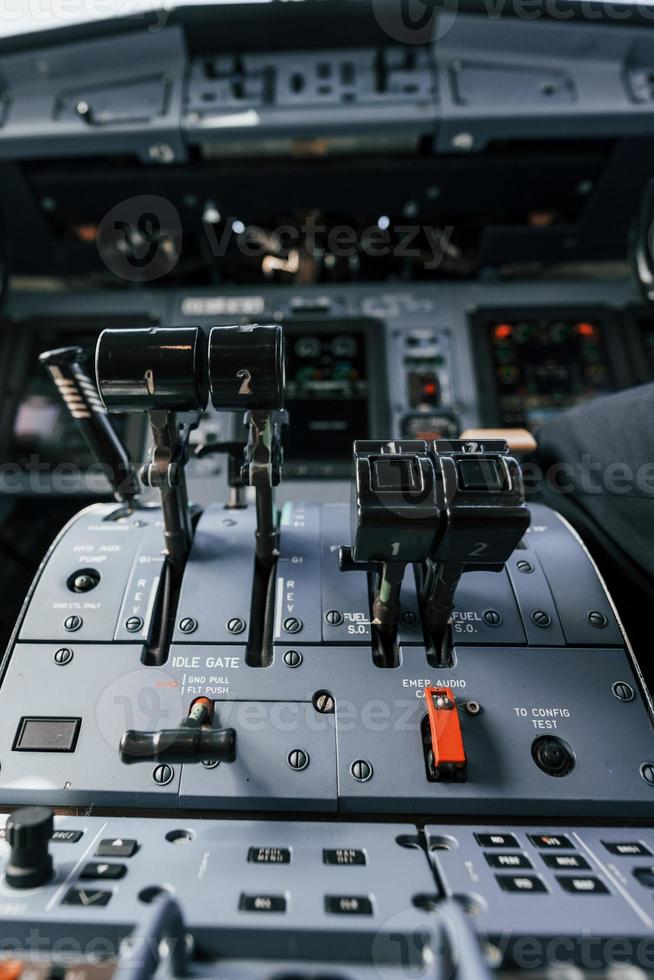 Close up focused view of cockpit electronics and control devices photo