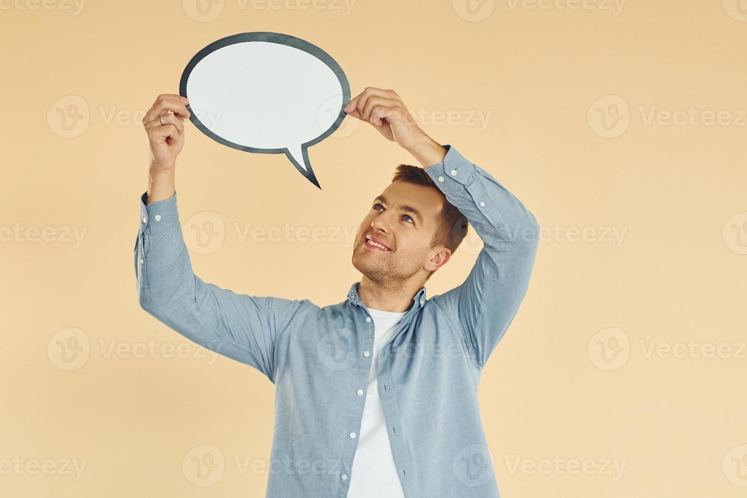 Ideas in the mind. Man standing in the studio with empty signs for the text photo