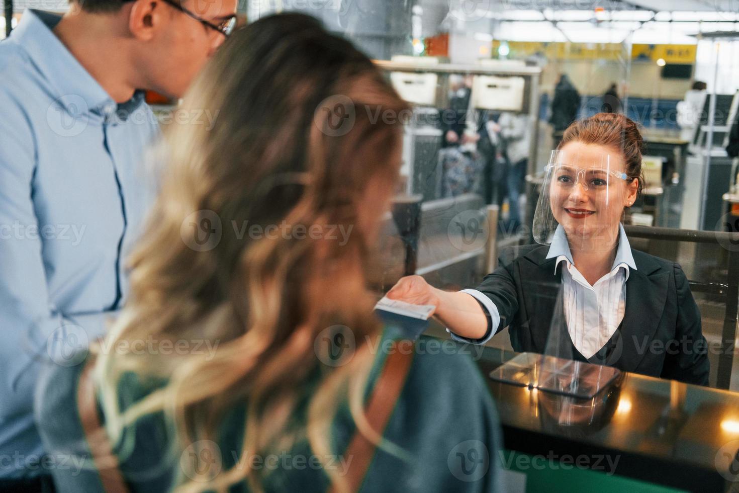 Professional service. Young couple is in the airport together photo