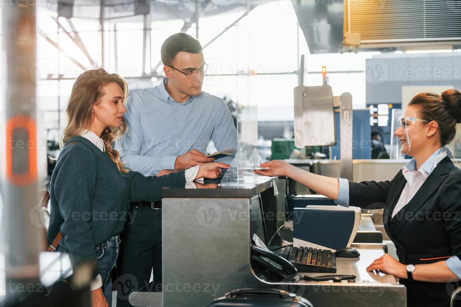 Professional service. Young couple is in the airport together photo