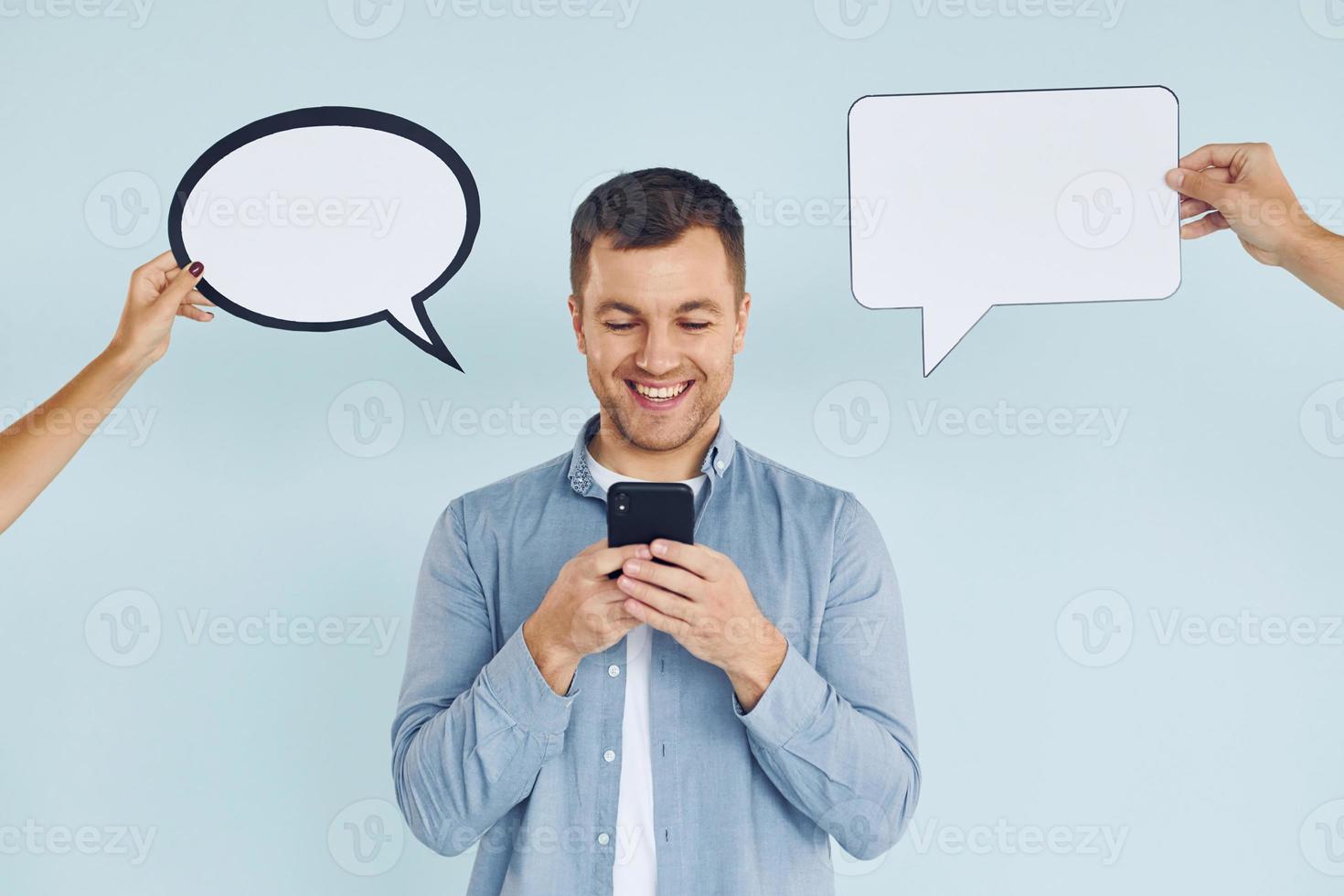 Smart person. Man standing in the studio with empty signs for the text photo