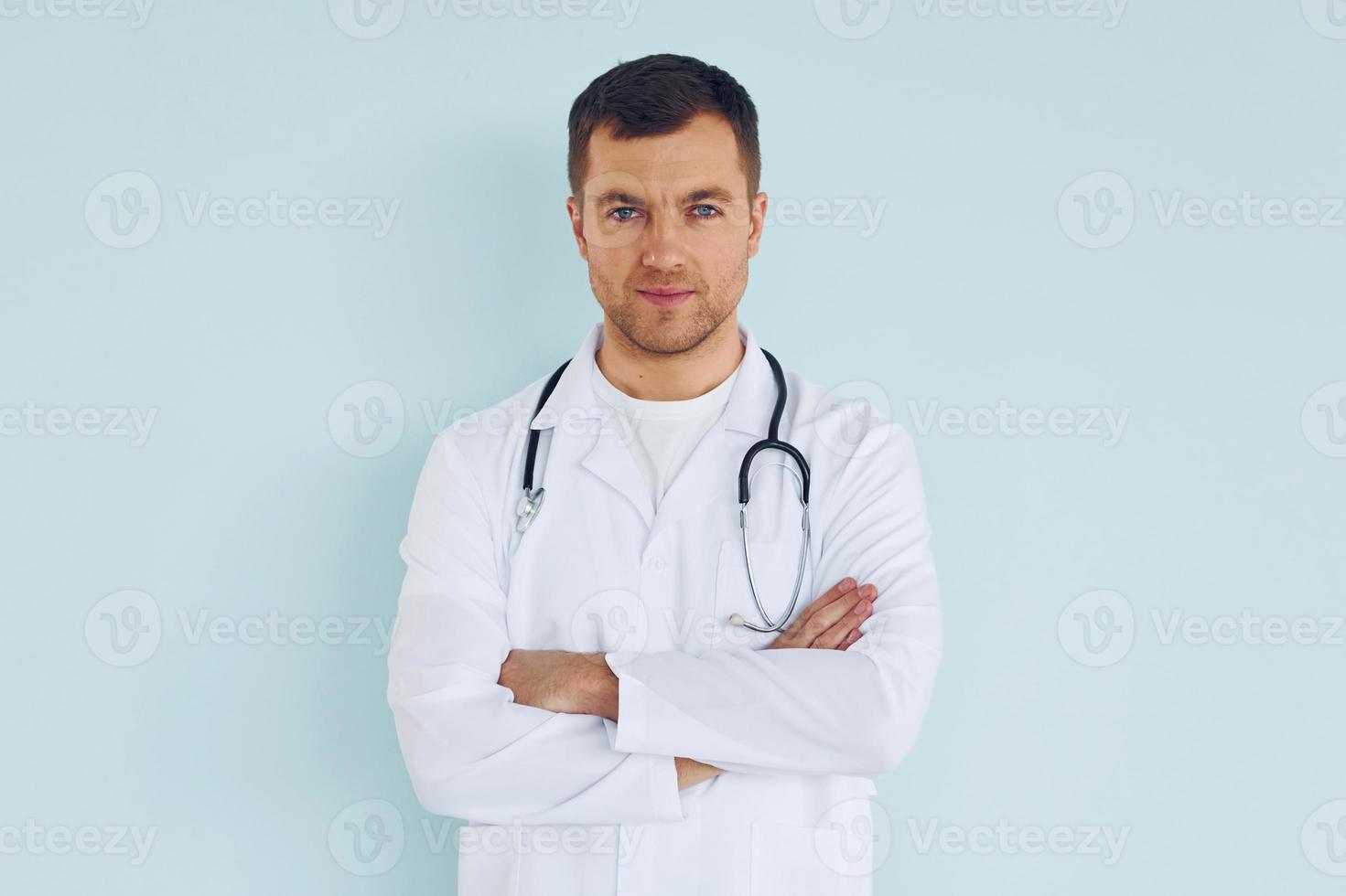 Doctor in uniform standing in the studio photo