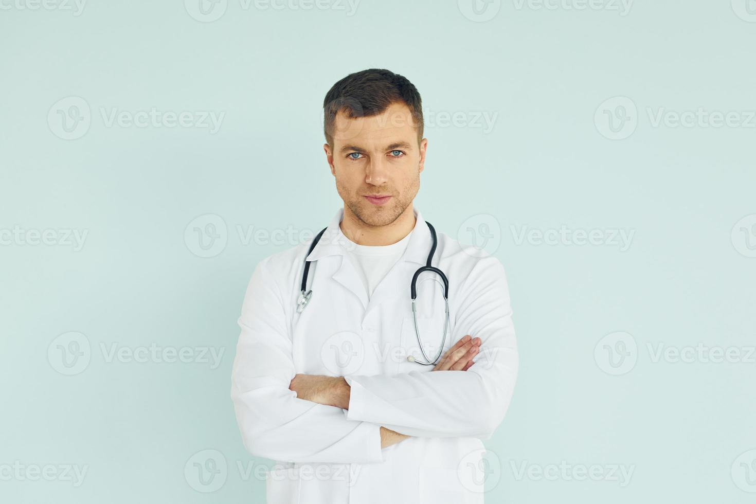 Doctor in uniform standing in the studio photo