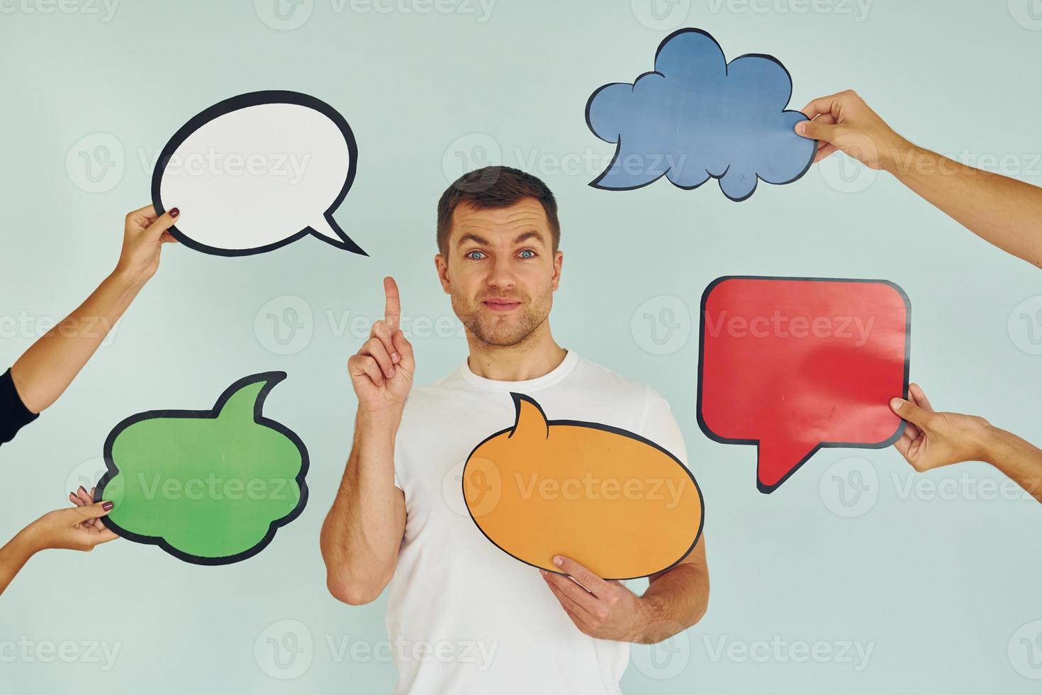 Many of the different thoughts. Man standing in the studio with empty signs for the text photo