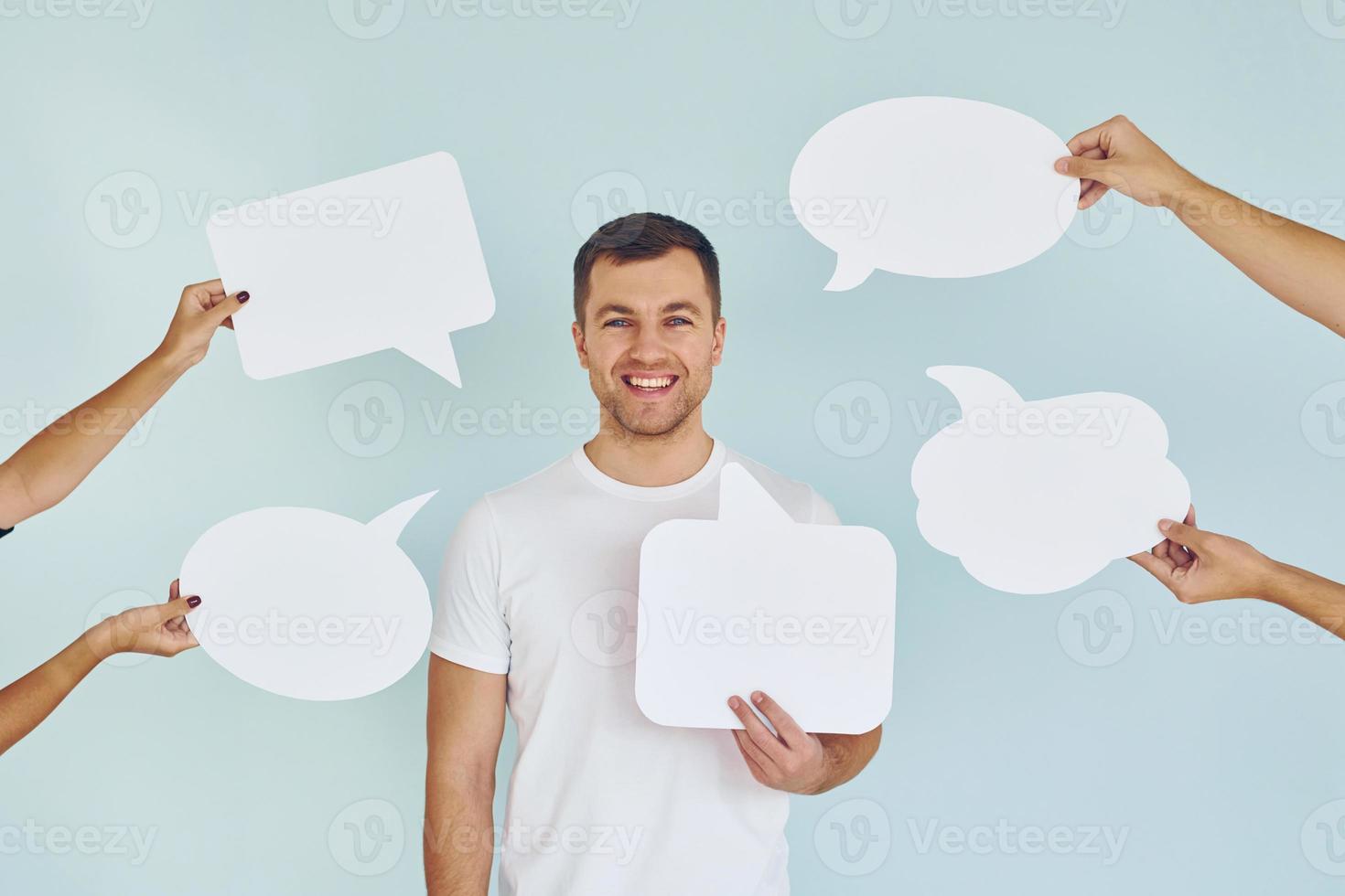 Man standing in the studio with empty signs for the text photo