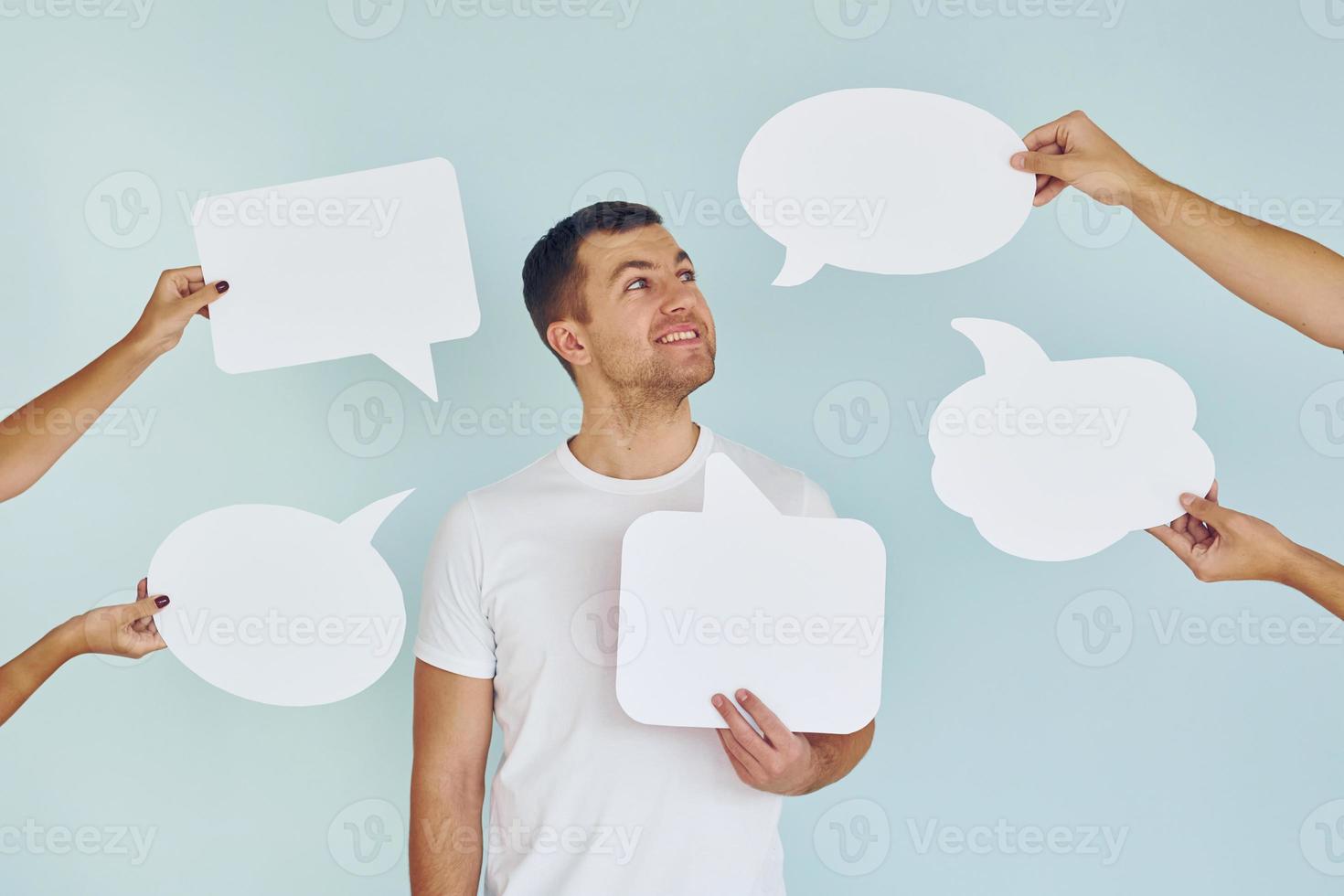 Man standing in the studio with empty signs for the text photo