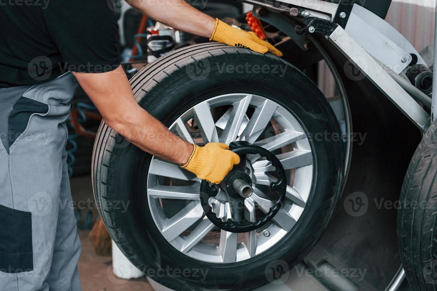Work in progress. Man in uniform is in the auto service photo