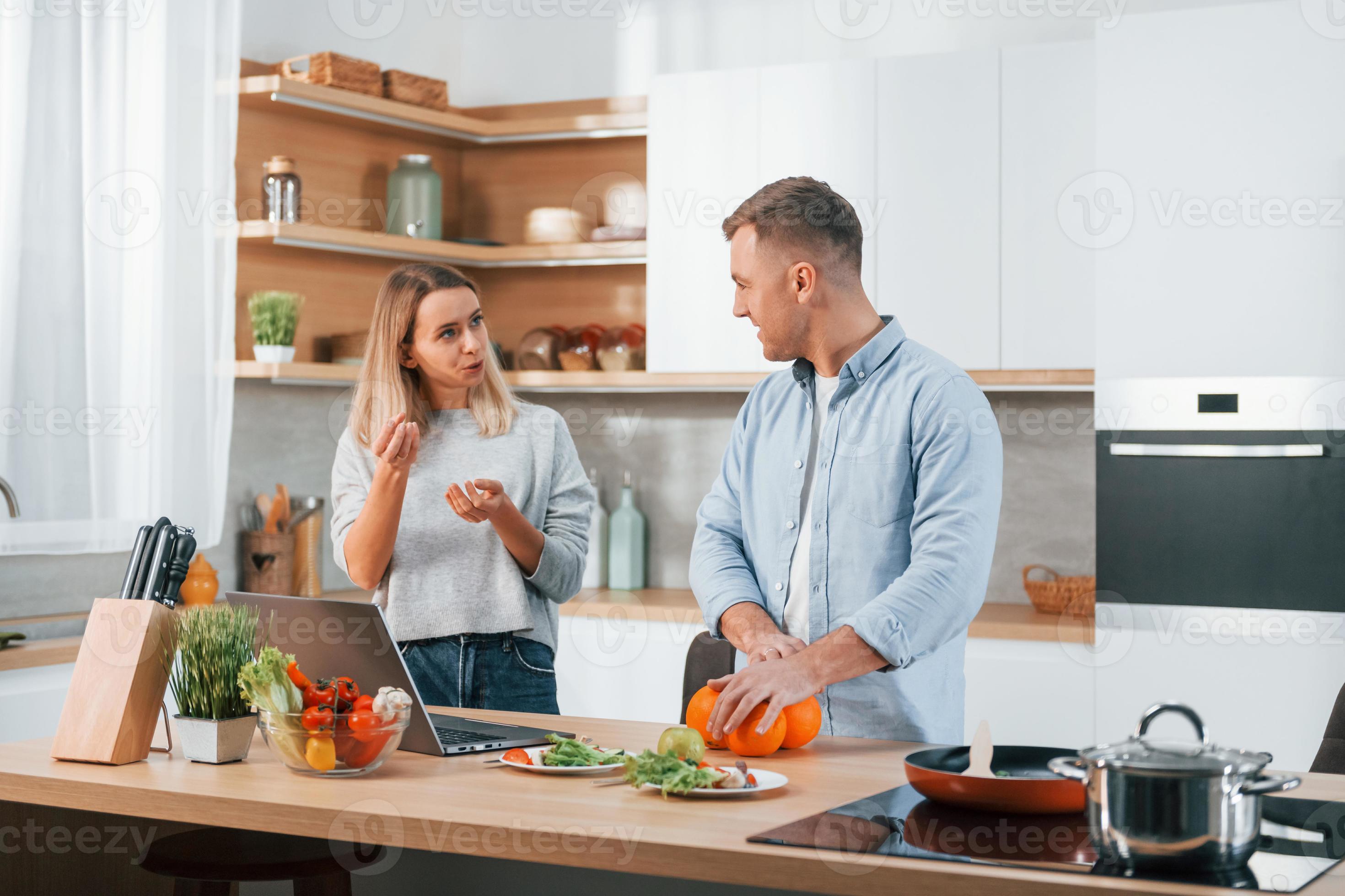 Having Weekend Together Couple Preparing Food At Home On The Modern having-weekend-together-couple-preparing-food-at-home-on-the-modern