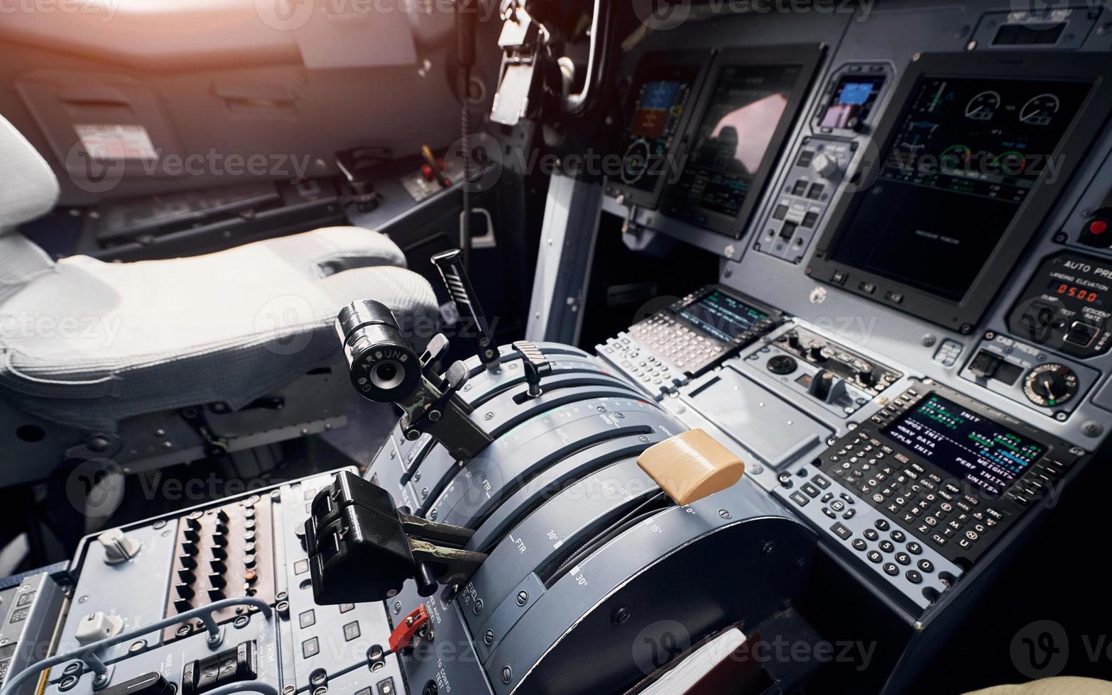 Knobs and buttons. Close up focused view of airplane cockpit photo