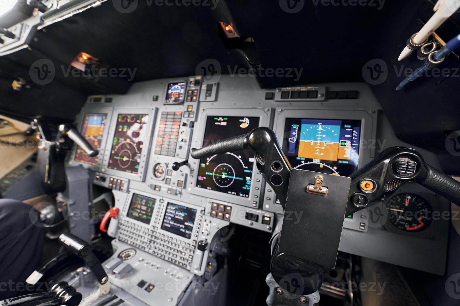 Different displays. Close up focused view of airplane cockpit photo