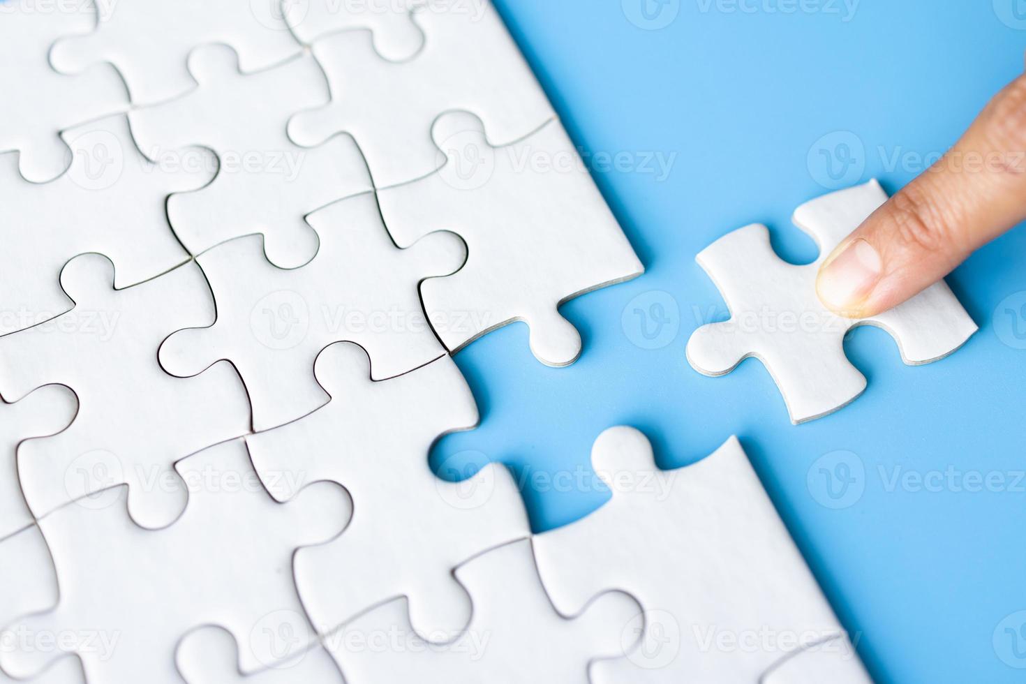 Jigsaw puzzle with missing piece. Completing final task, missing jigsaw puzzle pieces and business concept with a puzzle piece missing. photo