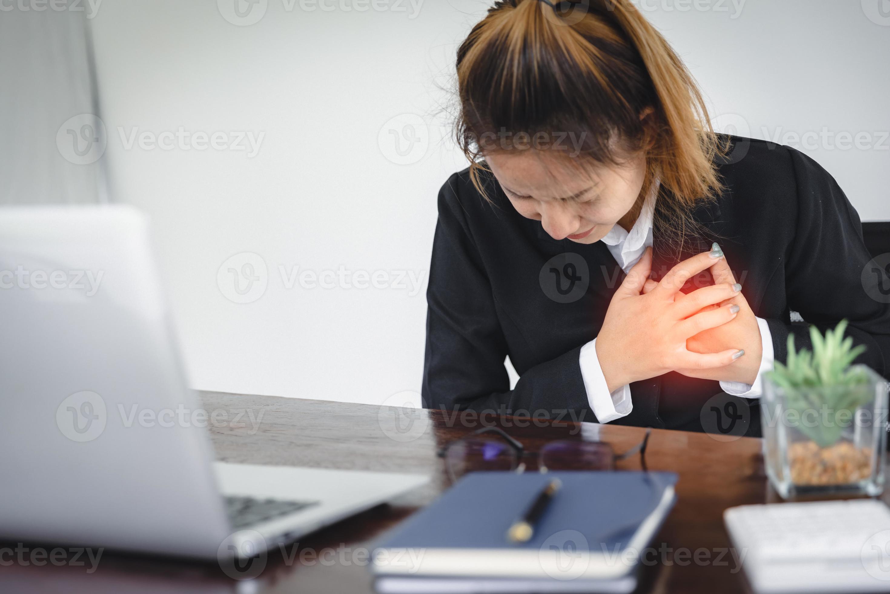 Woman clutching his chest from acute pain.Heart attack symptom