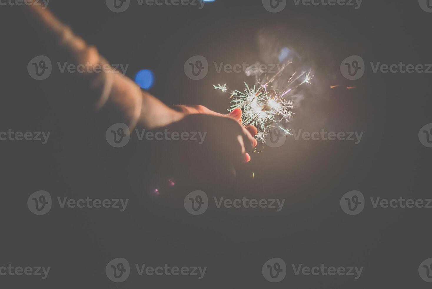 The fireworks burning sparkler in new year party night photo