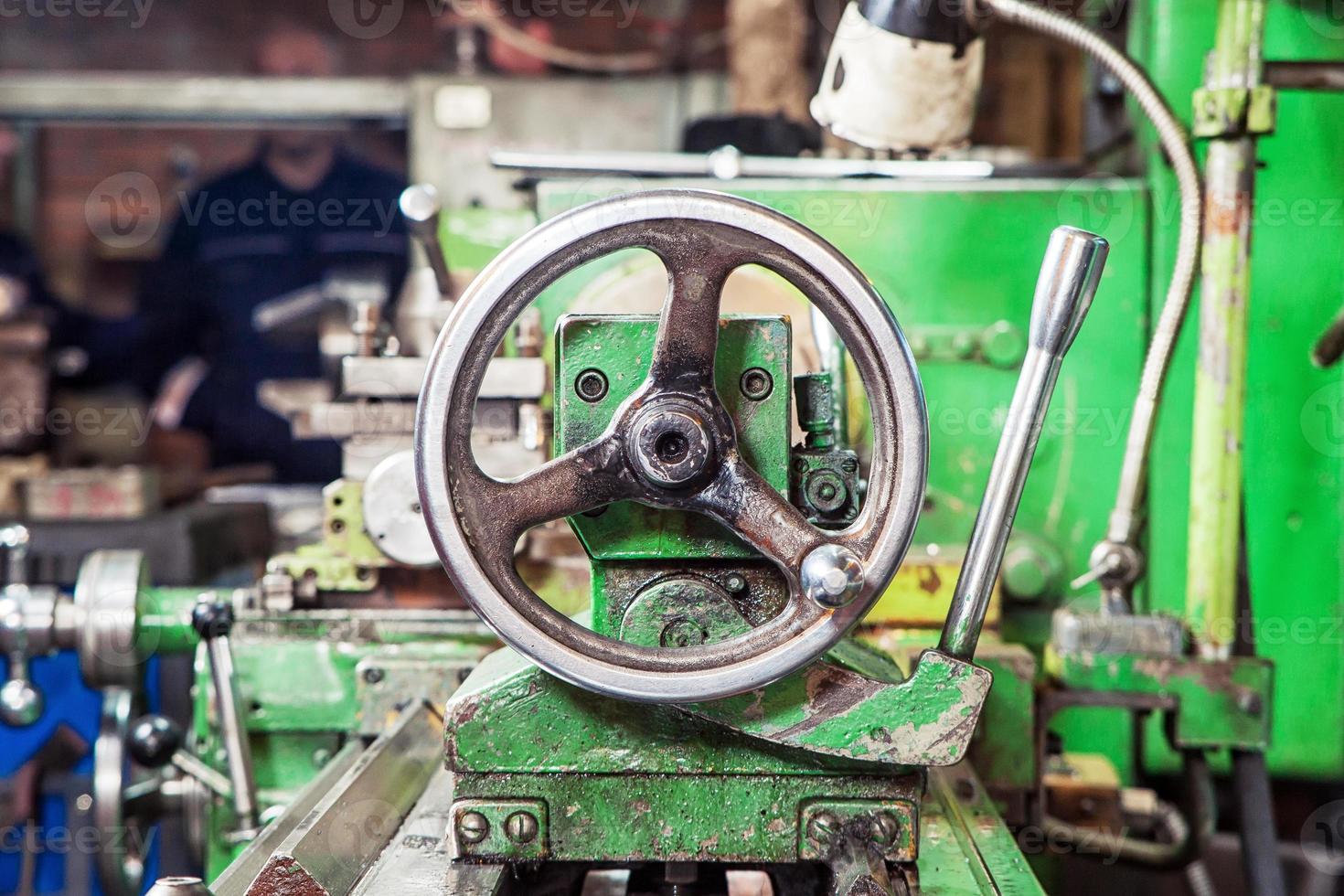 A close-up of a metallic lathe photo