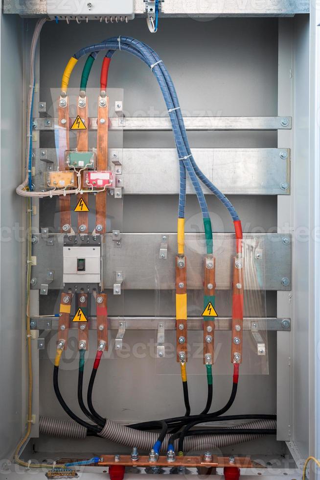 Row of bitcoin miners set up on the wired shelfs photo