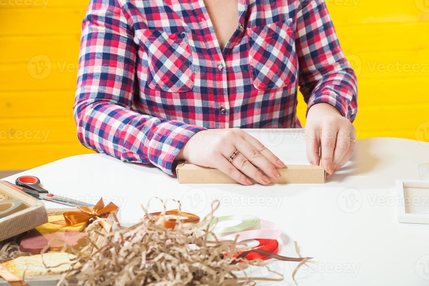 confectioner  packs boxes photo