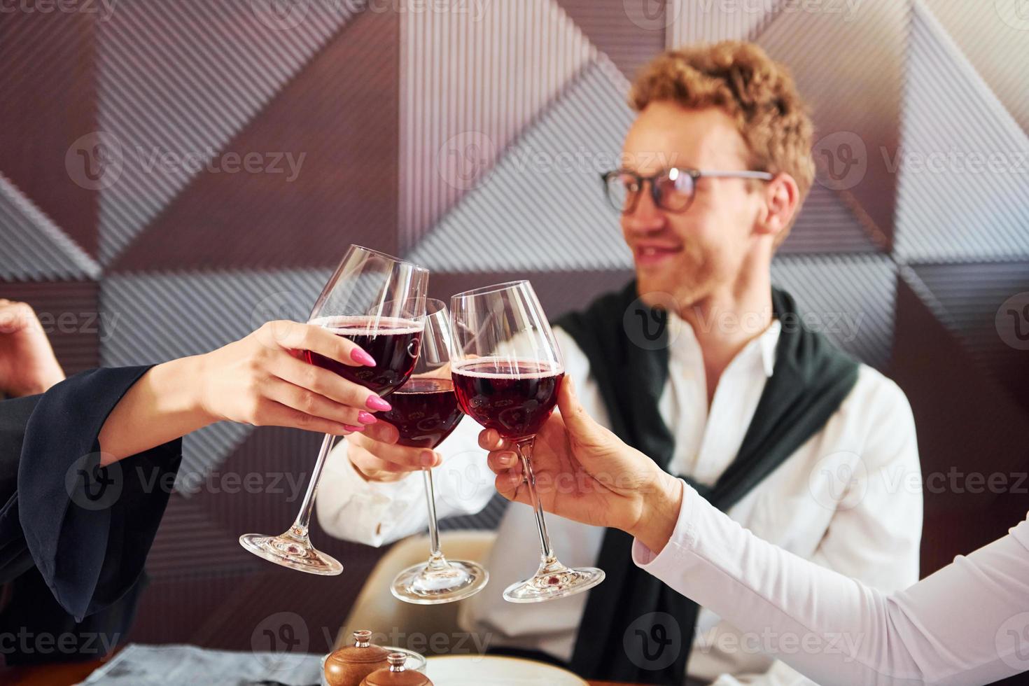 Young couple and mother. Indoors of new modern luxury restaurant photo