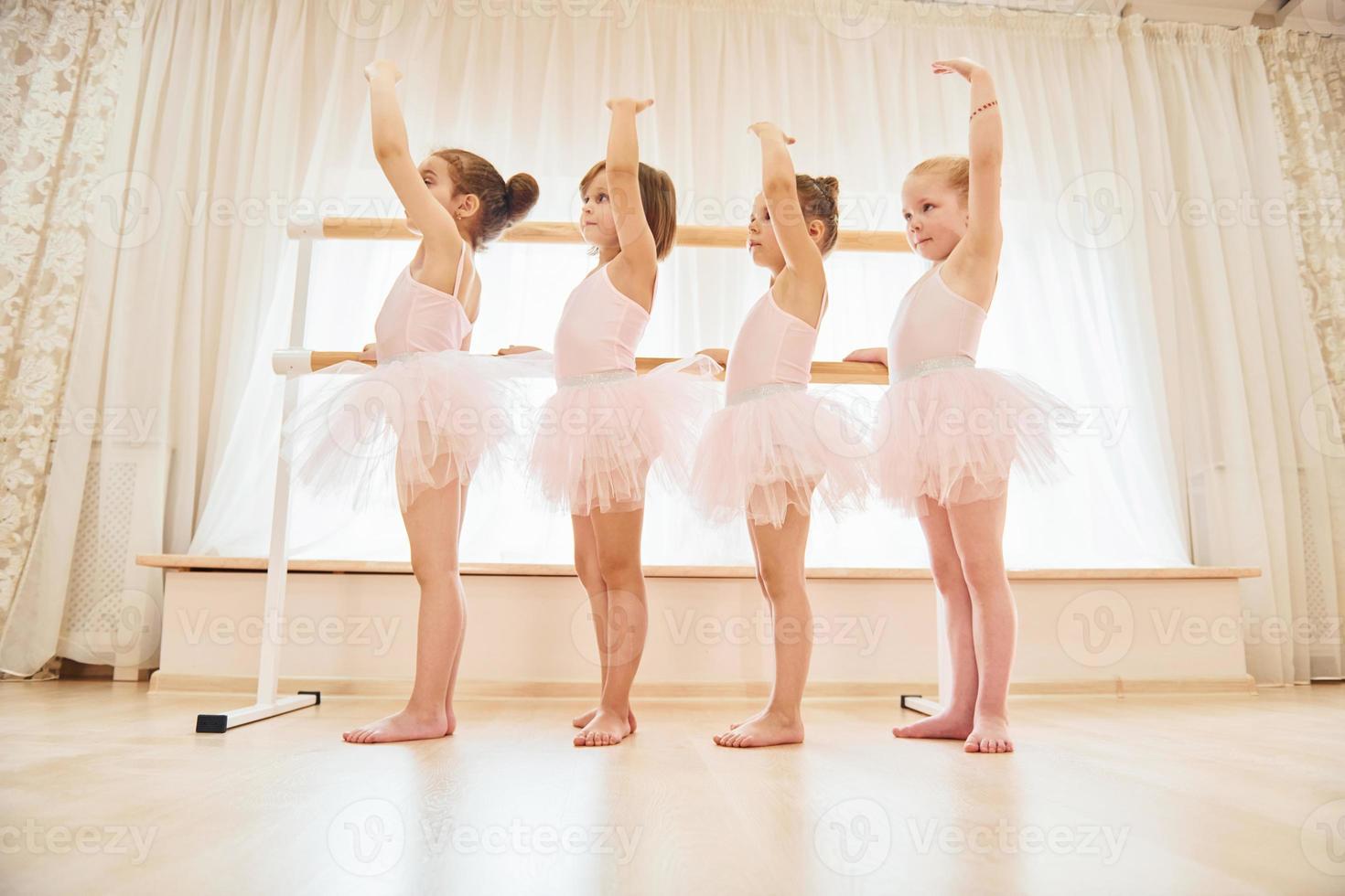 Conception of art. Little ballerinas preparing for performance photo