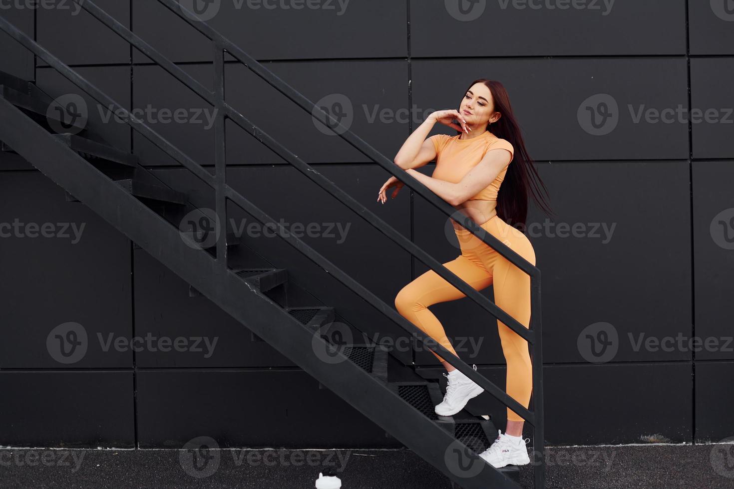 Young woman in sportswear have fitness session outdoors photo