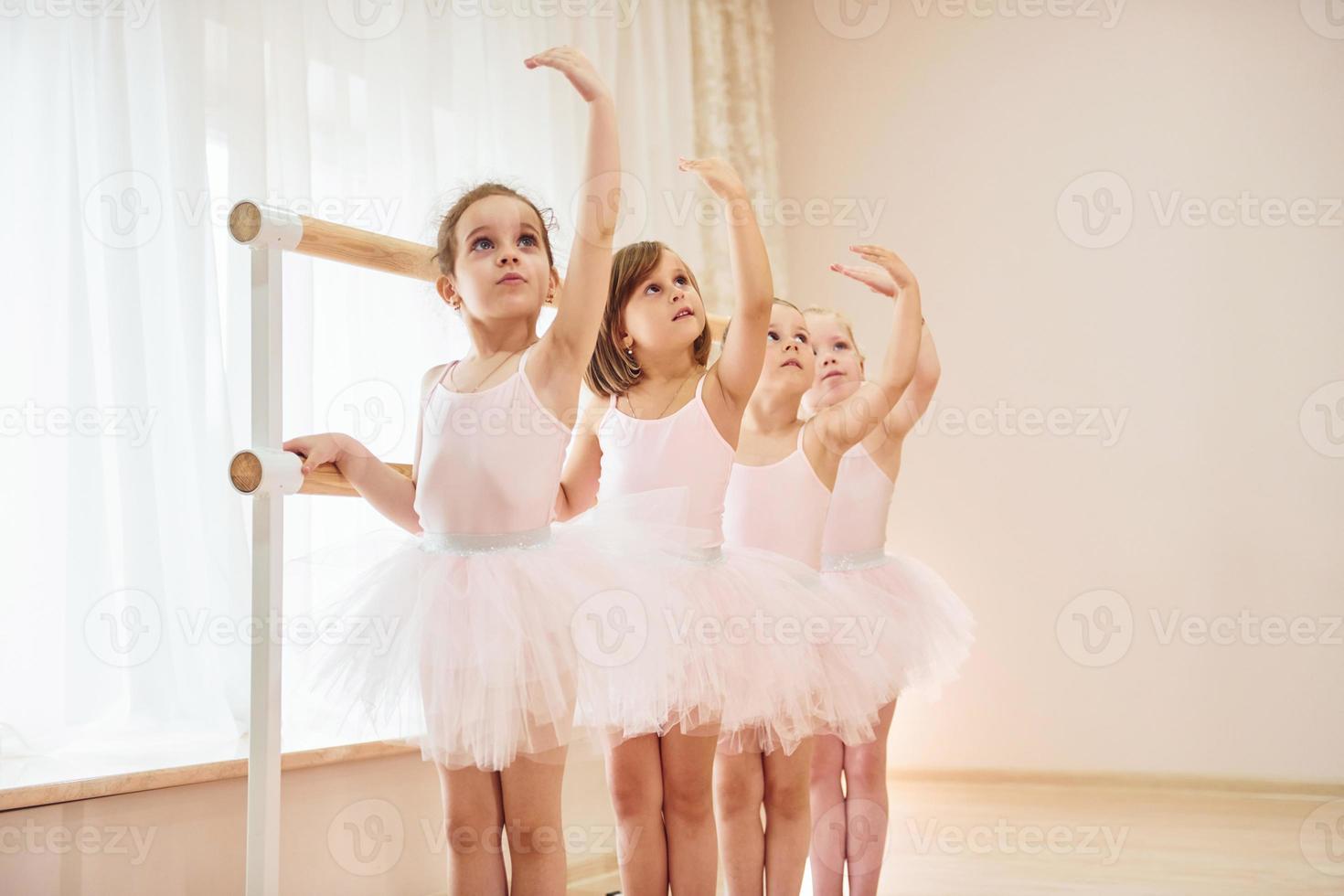 Conception of art. Little ballerinas preparing for performance photo